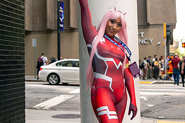 Woman in Red Costume Reaches