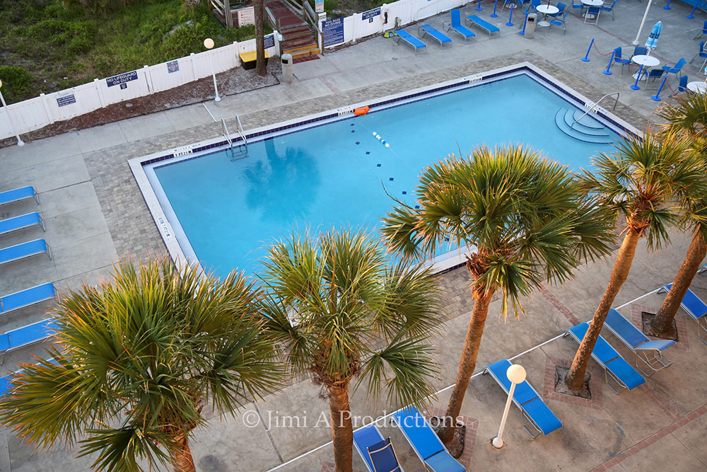 Sunrise above swimming pool