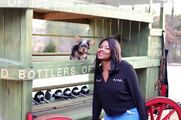 Owner smiles with her terrier dog on a cool winter day.